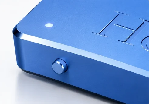 A corner of Memo: its button and status light.