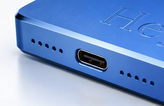 Pocket's edge: its USB-C port between two rows of speaker holes.